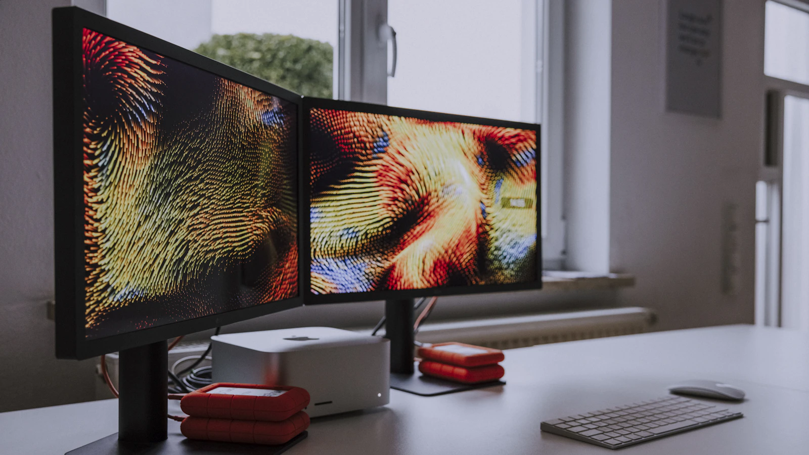 Creative dual-monitor workspace for building websites