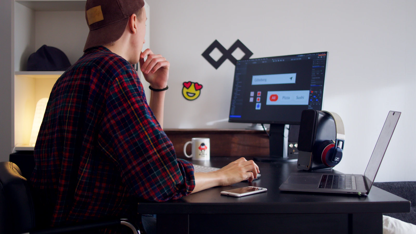 Frontend designer working on an interface at a desk