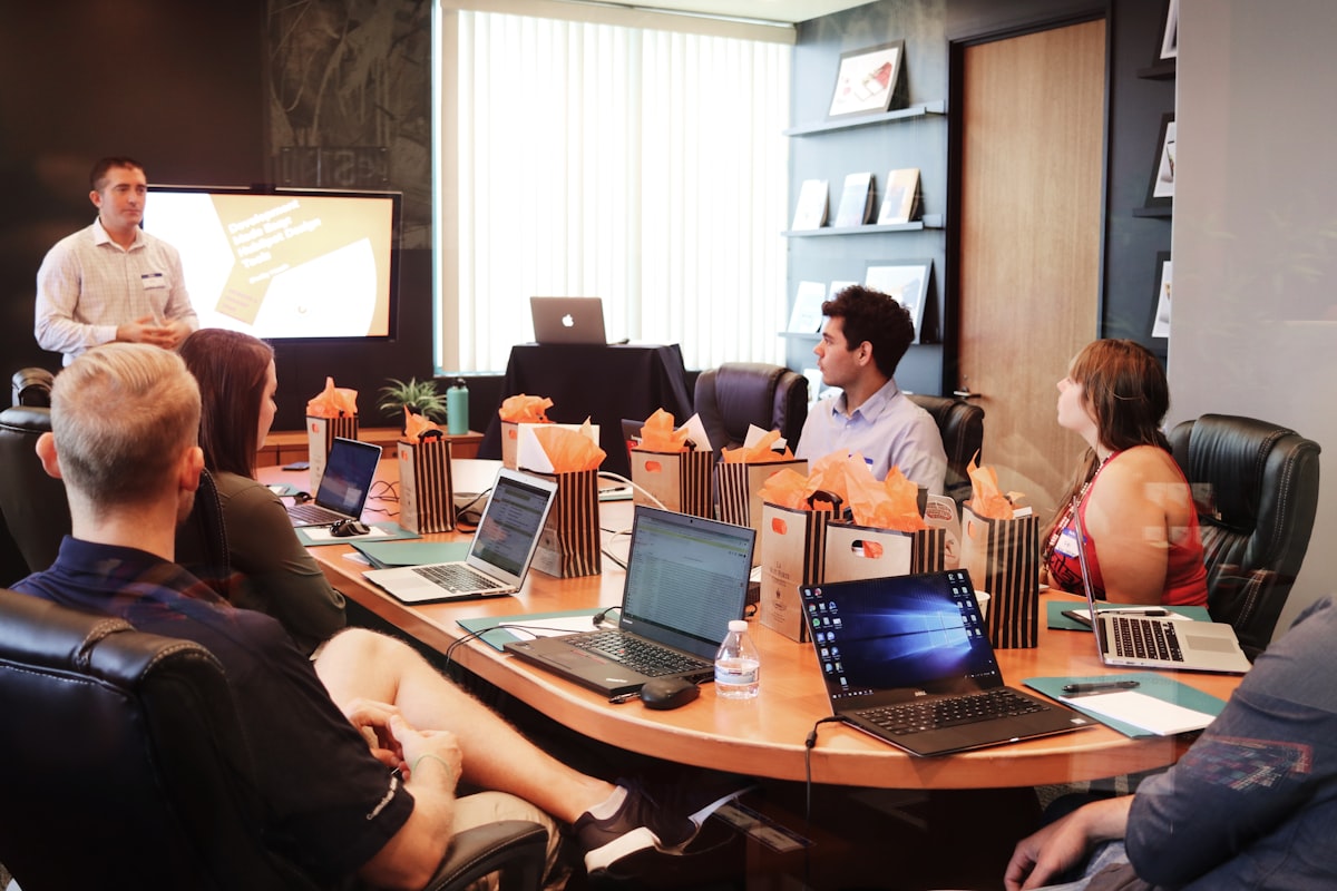 Presenter walking a meeting room through a project
