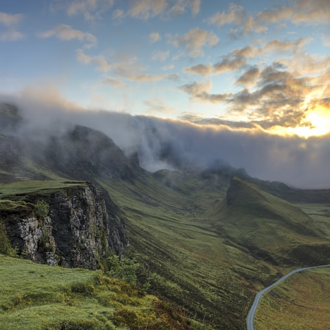 Fog rolling over forested hills