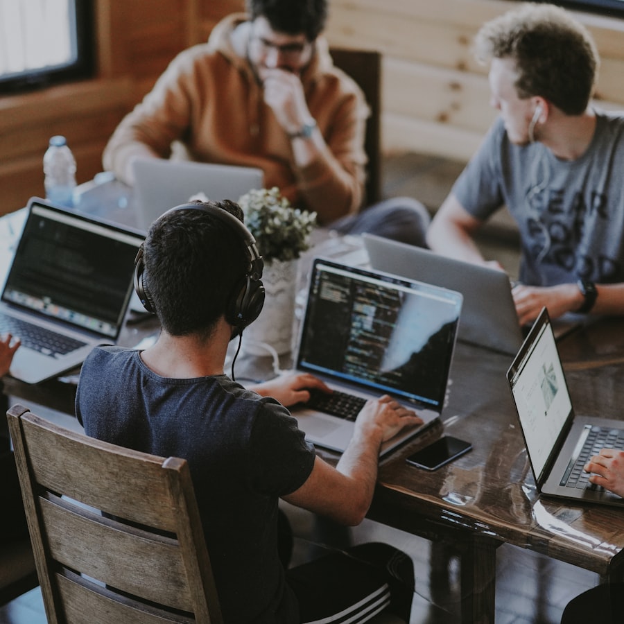 Team reviewing the product on a laptop